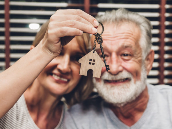 Couple with keys to home